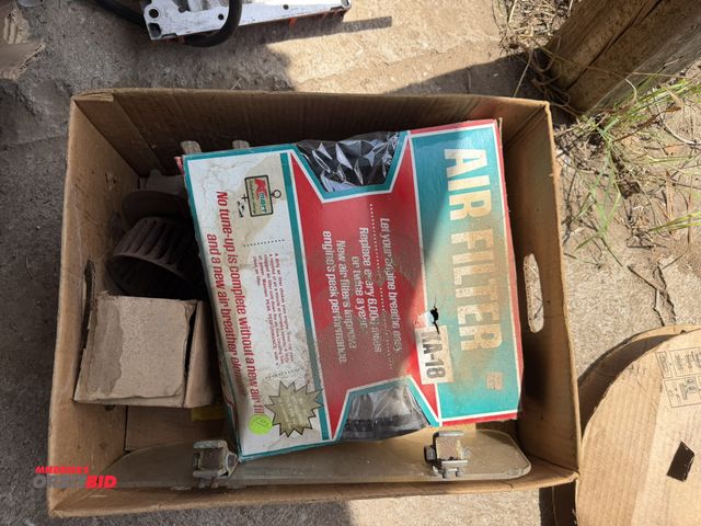 Lot 1-8556 - Lot of assorted vintage car parts, includes air filters, blower fans, steering wheel covers, visors,...