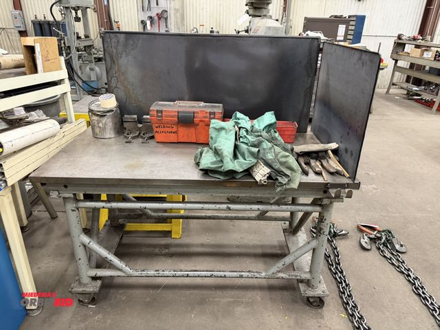 Lot 1-15226 - (1) heavy duty welding table, 58" long x 29.5" deep x 34" tall, mounted on casters with 1 1/4" thick...