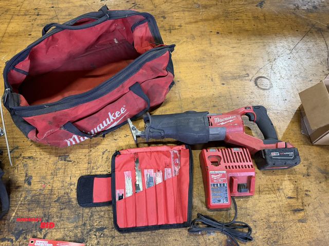 Lot 1-18507 - (1) Milwaukee 18V rechargeable Sawzall reciprocating saw with a Milwaukee M12/M18 charger, small bag...