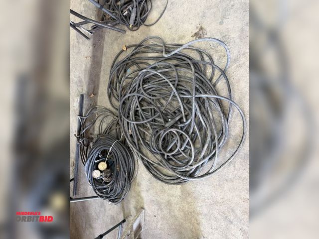 Lot 1-1430 - Large lot of assorted welding leads with (1) regulator, and various ground clamps.