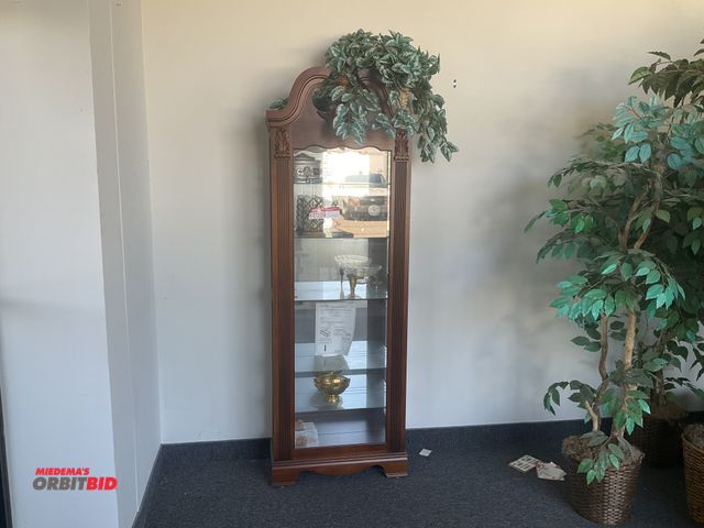 Lot 1-17209 - Pulaski Furniture Corporation collectors cabinet. Measures 26” wide by 10 1/2” deep by 79” at its pe...