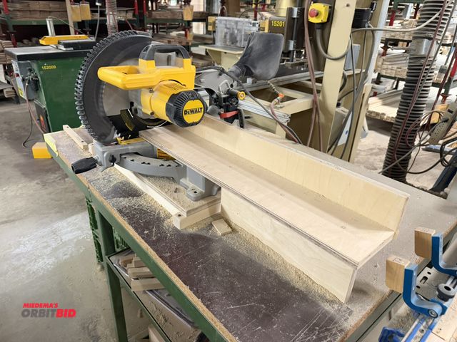 Lot 1-16680 - (1) DeWalt, model DWS715, 12" compound miter saw with steel frame and wood top table, 52.5" x 32", i...