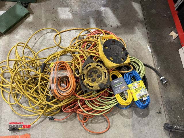 Lot 1-18538 - Lot of assorted extension cords, includes (2) cord reels with manual wind up, (1) new Performax 25',...