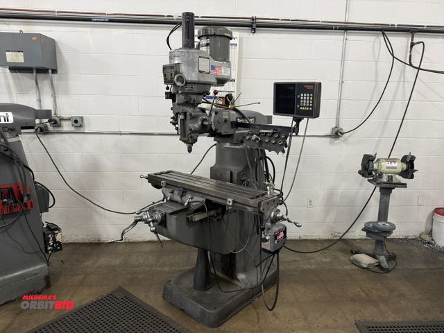 Lot 1-2294 - (1) Bridgeport vertical knee mill, angle head, 42" x 9" slotted table, 150 to 4200 RPM spindle speed...