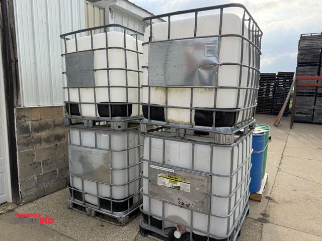 Lot 1-102606 - (4) Plastic tanks in metal forkable cage, 250 gallon