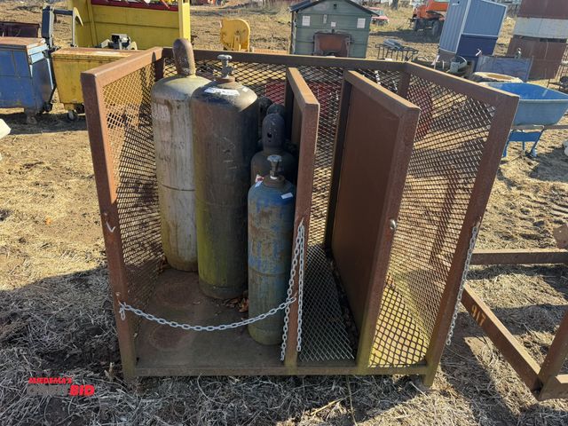 Lot 1-2937 - (1) steel safety gas bottle rack, 55" wide x 42" deep x 52" tall, includes 100 lb. gas tank, 100 lb....