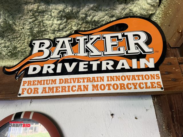 Lot 1-8190 - (1) approx. 17" width x 12" height "Baker Drive Train" tin sign.