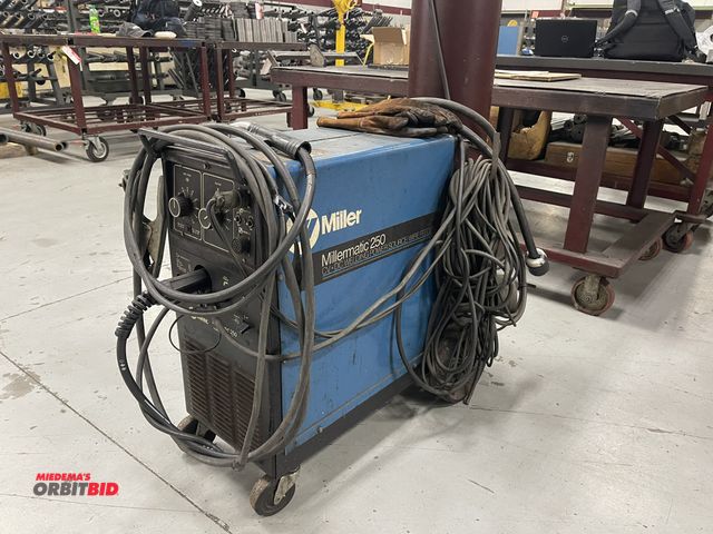 Lot 1-19523 - (1) Millermatic 250 CV.DC welding power source wire feeder, includes gun, and Miller Spoolmatic 30A ...