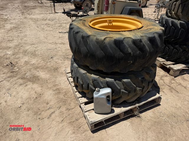 Lot 1-18236 - (2) Alliance 17.5-25 tires on 5-bolt rims, tires are used, one is missing chunk of rubber from sidew...