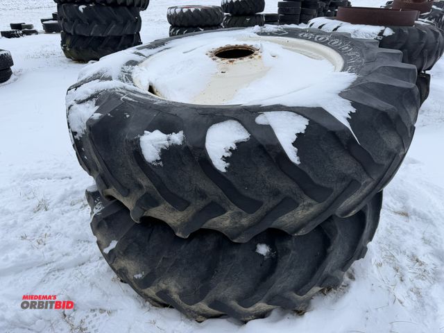 Lot 1-11636 - (1) set of Goodyear 18.4-38 tires on 10-bolt rims, tires are cracked and weather checked.