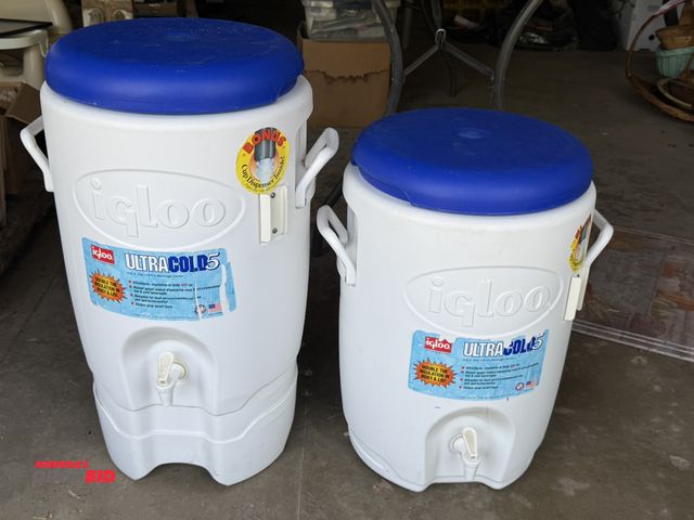 Lot 1-8379 - Lot including (2) Igloo Ultra Cold 5, 5 gallon capacity drink coolers (1 with base).