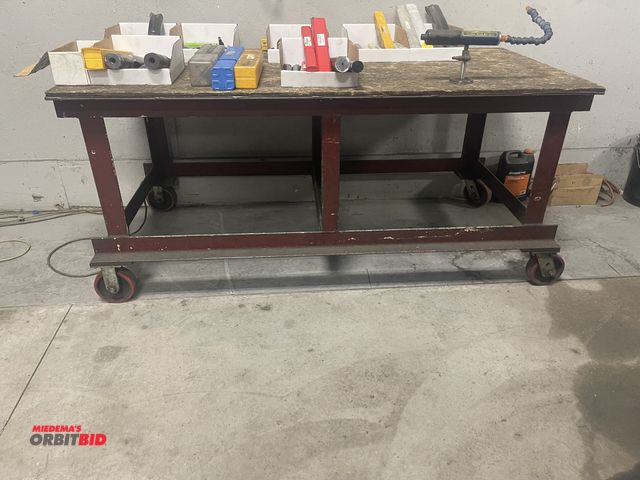 Lot 1-19296 - (1) heavy duty steel frame shop table, 72" x approx. 36" with wood top, does not include contents.
