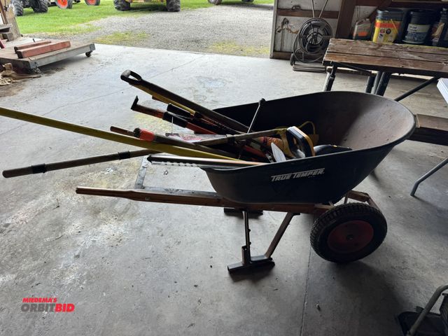 Lot 1-12304 - (1) True Temper steel wheelbarrow with dual wheels and wood handles, includes assorted hand tools, a...