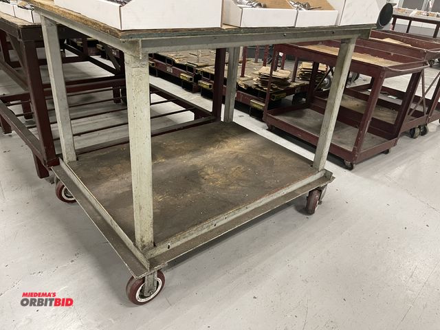 Lot 1-19398 - (1) heavy duty steel rolling table/bench, 48" x 48", wood top.