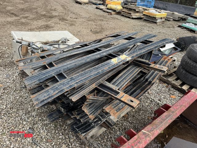Lot 1-16033 - (1) skid of assorted steel stake truck stakes, most appear to be 6' wide x approx. 40" tall.