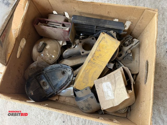 Lot 1-8562 - Large lot of 1955-57 Chevy parts, includes tail lights, headlights, trim pieces, and more.