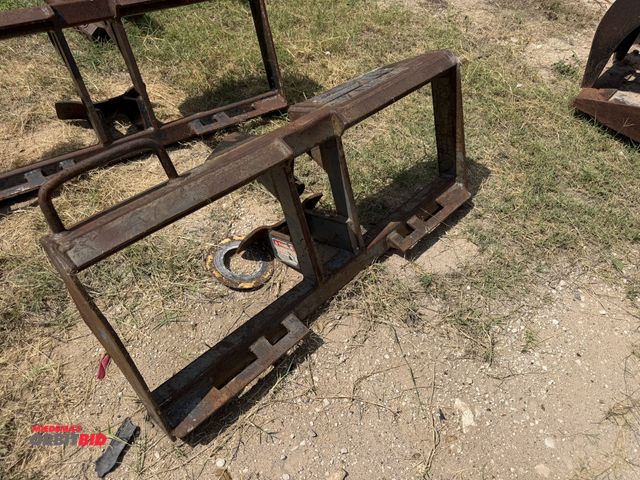 Lot 1-9585 - (1) post hole auger skid steer attachment frame, frame only.
