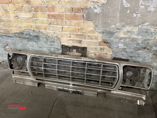 Lot 1-1238 - (1) grill with insert and headlight mounts for a 1978/79 Ford F Series pickup truck or Bronco.