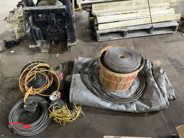 Lot 1-1186 - Lot of assorted items, including (1) large tarp, various spools of wire, (4) rolls of 3" wide steel ...