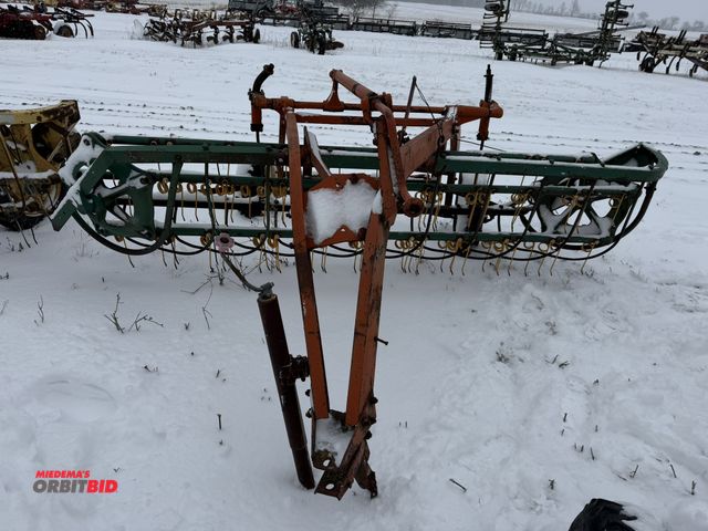 Lot 1-10406 - (1) New Idea 400 hay rake, 5-bar, 8' wide, ground driven, 1 tire will need repair (currently off bea...