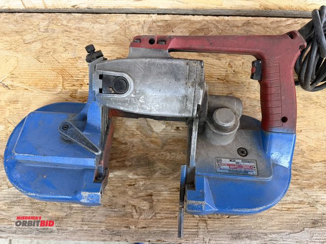 Lot 1-1321 - (1) Milwaukee, Cat #6230, heavy duty electric hand held portable band saw, working condition unknown...