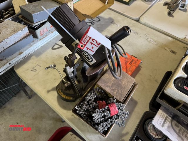 Lot 1-12266 - (1) Oregon chainsaw sharpener with assorted chainsaw chain.