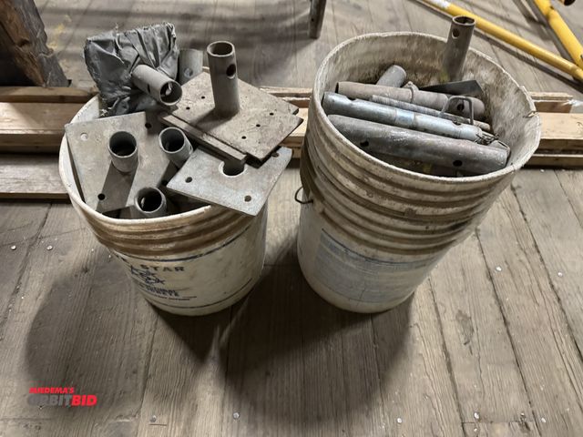 Lot 1-2617 - (1) bucket of scaffold platform feet, and (1) bucket of scaffolding pins.  (Greg)