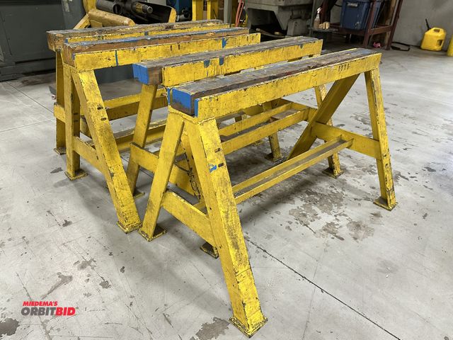 Lot 1-19164 - Set of (4) matching 4' width x 31.5" height heavy duty angle iron saw horses with 4" x 4" wood top i...