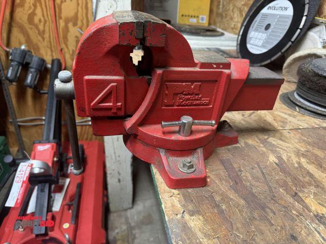 Lot 1-4155 - (1) PM 4" bench mounted vise, winning bidder responsible for proper removal.