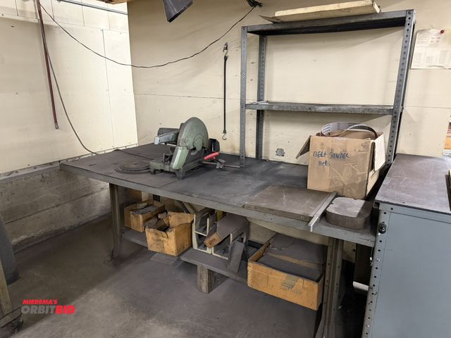Lot 1-937 - (1) steel framed work bench with wood top, includes Hitachi 14" abrasive cut off saw, (1) paper cutt...