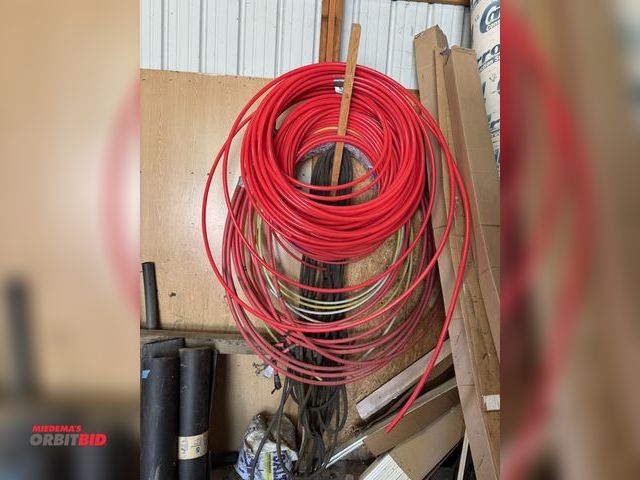 Lot 1-14206 - Lot of assorted Pex tubing, includes red and blue, 1/2", with assorted garden hoses.