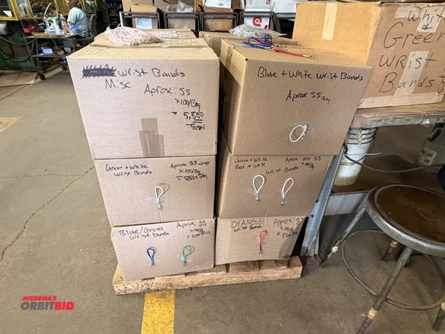Lot 1-18840 - (13) boxes of wrist bands (approx. 5500 per box), various colors, 2 of the boxes have 4100 bands.