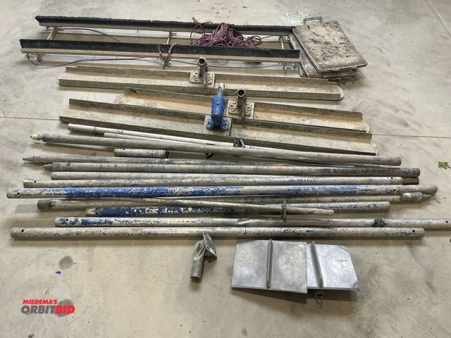 Lot 1-18836 - Large lot of assorted concrete finishing tools, includes (2) 6' trowel, (1) 60" trowel, assorted ext...