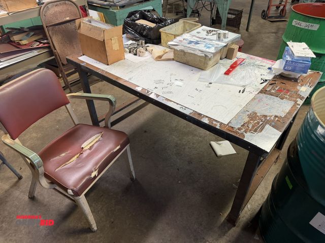 Lot 1-18789 - (1) 60" width x 30" height x 34" depth steel work table, (1) steel framed chair with vinyl padded se...