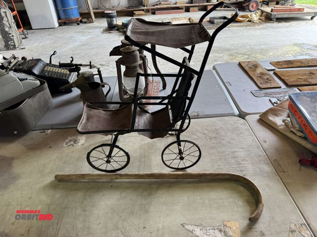 Lot 1-12274 - (1) vintage kid's metal stroller.