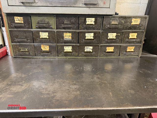 Lot 1-6386 - (1) 18-drawer assorted metal pull out drawer parts bin, with assorted pipe taps, large pipe taps, sm...
