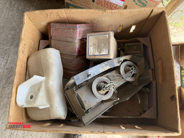 Lot 1-8588 - Lot of assorted vintage GM car/truck parts, includes GM, Oldsmobile, and more.