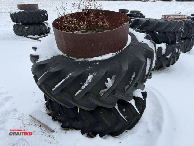Lot 1-11643 - (1) set of clamp on duals with 16.9-28 tires, tires are cracked and weather checked.