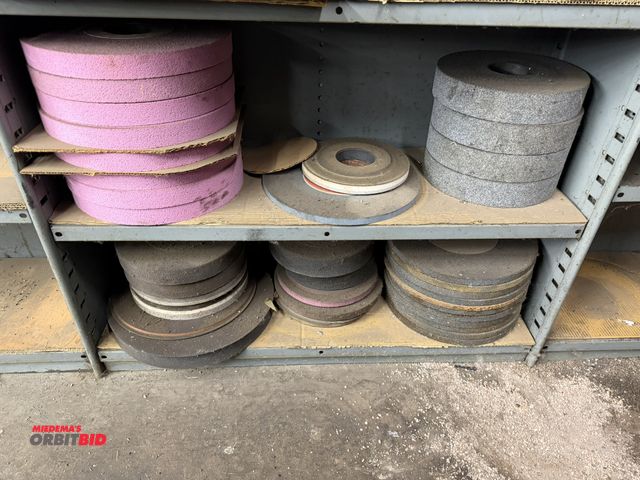 Lot 1-1829 - Contents of 2 shelves shown in photos, includes (8) new Radiac 12" x 1 1/4" x 3" grinding wheels, (4...