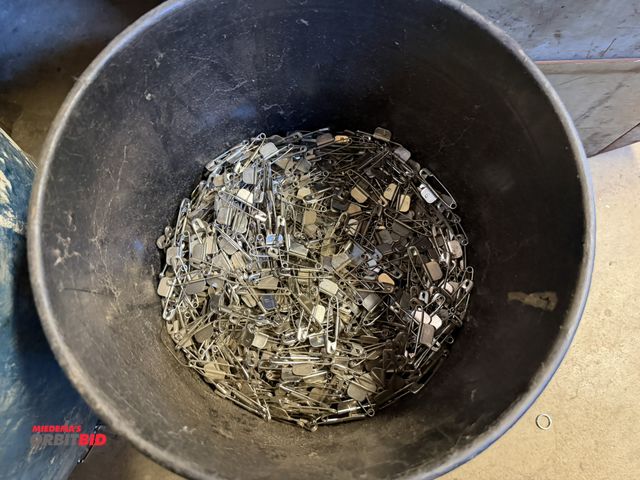 Lot 1-18854 - (1) approx. 1/2 full 5-gallon pail of 2" safety pins with stainless steel marking tag attached.