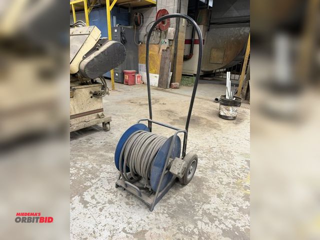 Lot 1-17107 - (1) portable, 3 phase extension hose reel cart with approx. 100' + of 10:3 heavy duty electrical cor...