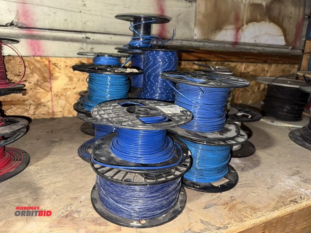 Lot 1-4511 - Lot of (14) partial spools of 16 gauge wire, 12 spools are blue/2 are white.