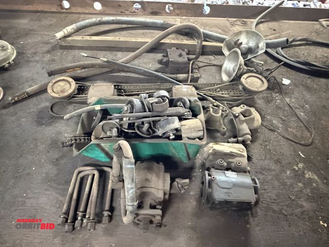 Lot 1-18610 - Lot of assorted truck parts, includes hydraulic pump with wet kit adapter, assorted caster wheels, l...