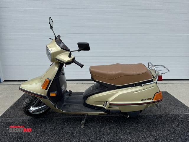 Lot 1-6455 - 1983 Yamaha 180 (1) Moped, air cooled, shaft drive, front storage, foot pedal brake, includes manual...