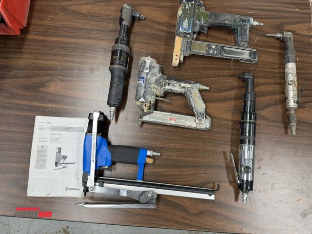 Lot 1-16872 - Large lot of assorted pneumatic hand tools, includes (3) staple guns, (2) air ratchets, and (1) righ...