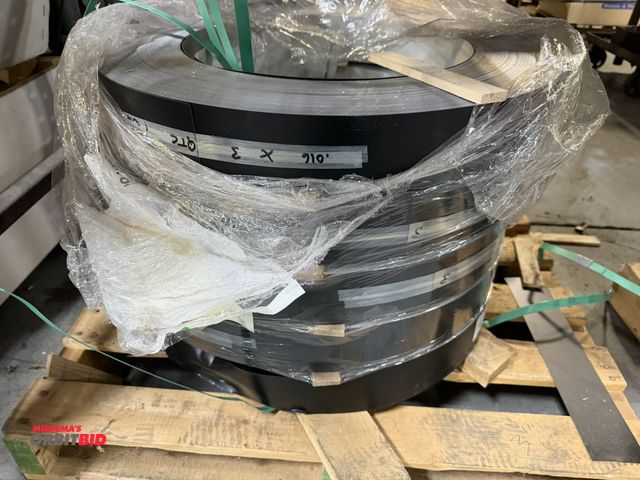 Lot 1-18668 - Lot of (5) coils of 3" x .016" anodized aluminum, black with white inside.