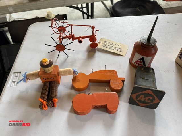 Lot 1-12283 - (1) Allis-Chalmers and Case IH items, including tractors, oil can, hitch cover, Case IH harvester, w...