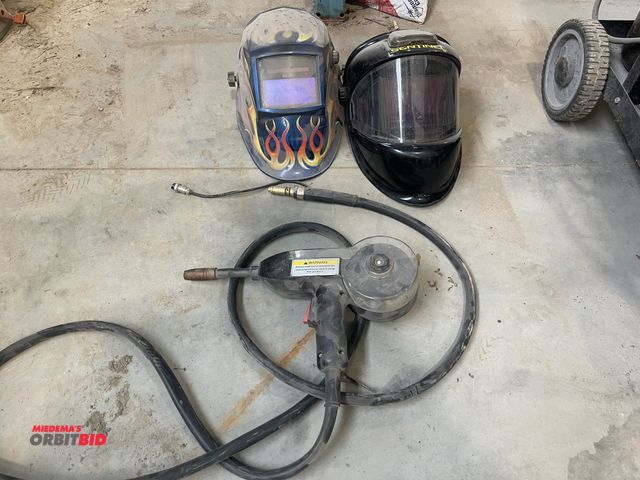Lot 1-18855 - (1) unknown brand wire spool welding gun, and (2) welding helmets.