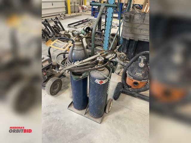 Lot 1-18858 - (1) torch tank cart with torch hose and (2) regulators, and striker, does not include bottles.