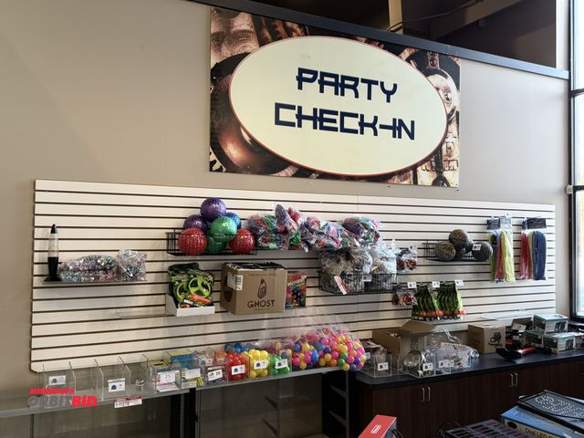 Lot 1-11281 - Lot of (2) slat board sections mounted on wall, each measures 8' x 48", winning bidder responsible f...